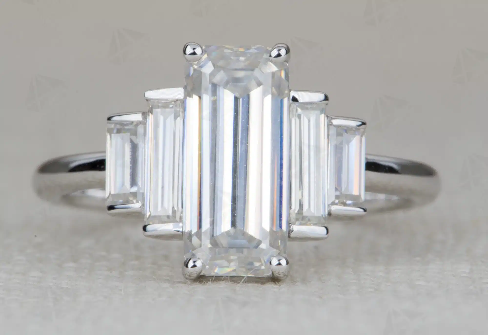 ring-style-rectanglesquare-shape-center-stone-with-baguette-sides baguette engagement ring