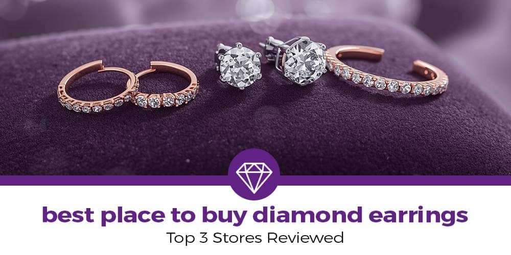 Elegant flat lay of luxury diamond earrings — including sparkling diamond studs and diamond hoops — displayed on a dark purple velvet cushion. Perfect visual for the blog ‘Best Place to Buy Diamond Earrings: Top 3 Stores Reviewed,’ highlighting luxury and sophistication
